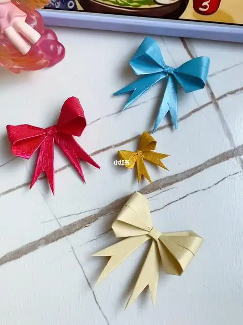 一张纸折出的精美蝴蝶结,好看又简单,放在礼盒上完美#我的手工日常
