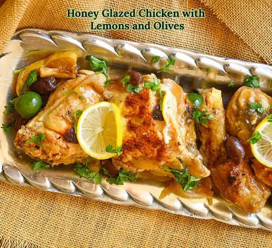 chicken cooked with lemons, olives and onions  is browned on the