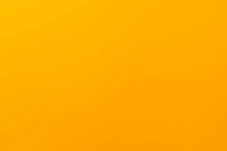带有哑光纹理的黄色纯色背景.壁纸设计照片