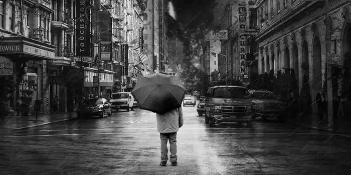 黑白简约城市下雨打伞背景