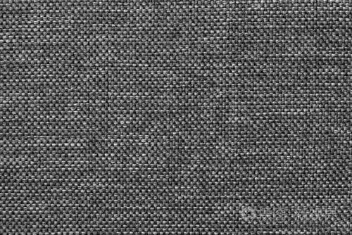 深灰色光泽背景的密织套袋织物,特写.结构的钢布具有天然的纹理.
